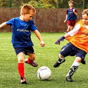 children playing football