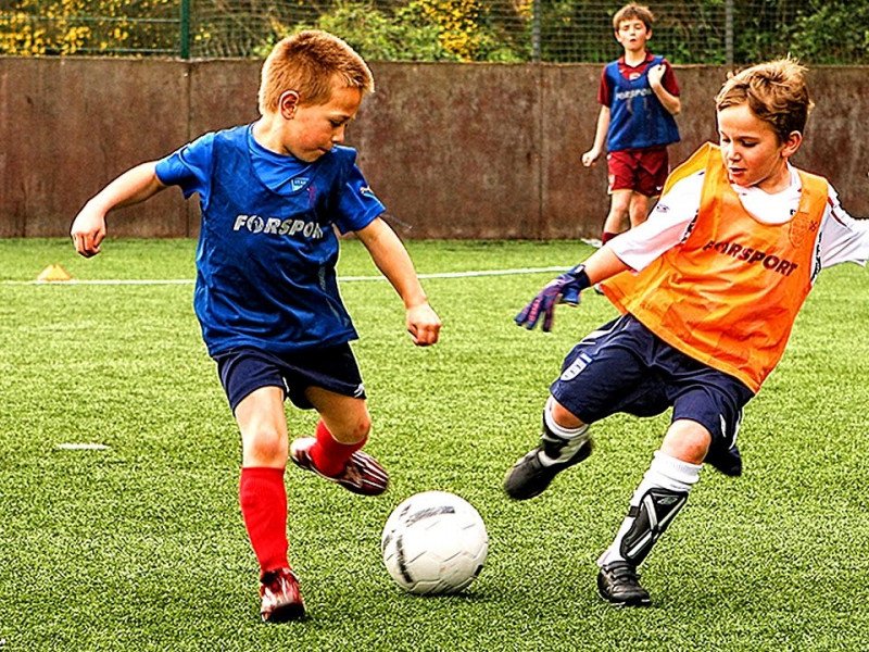 children playing football