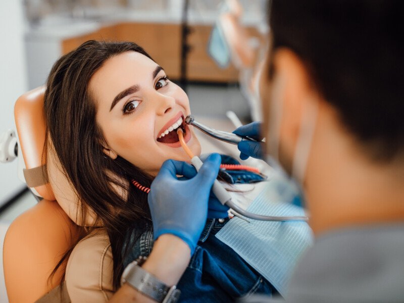 young female patient visiting dentist office